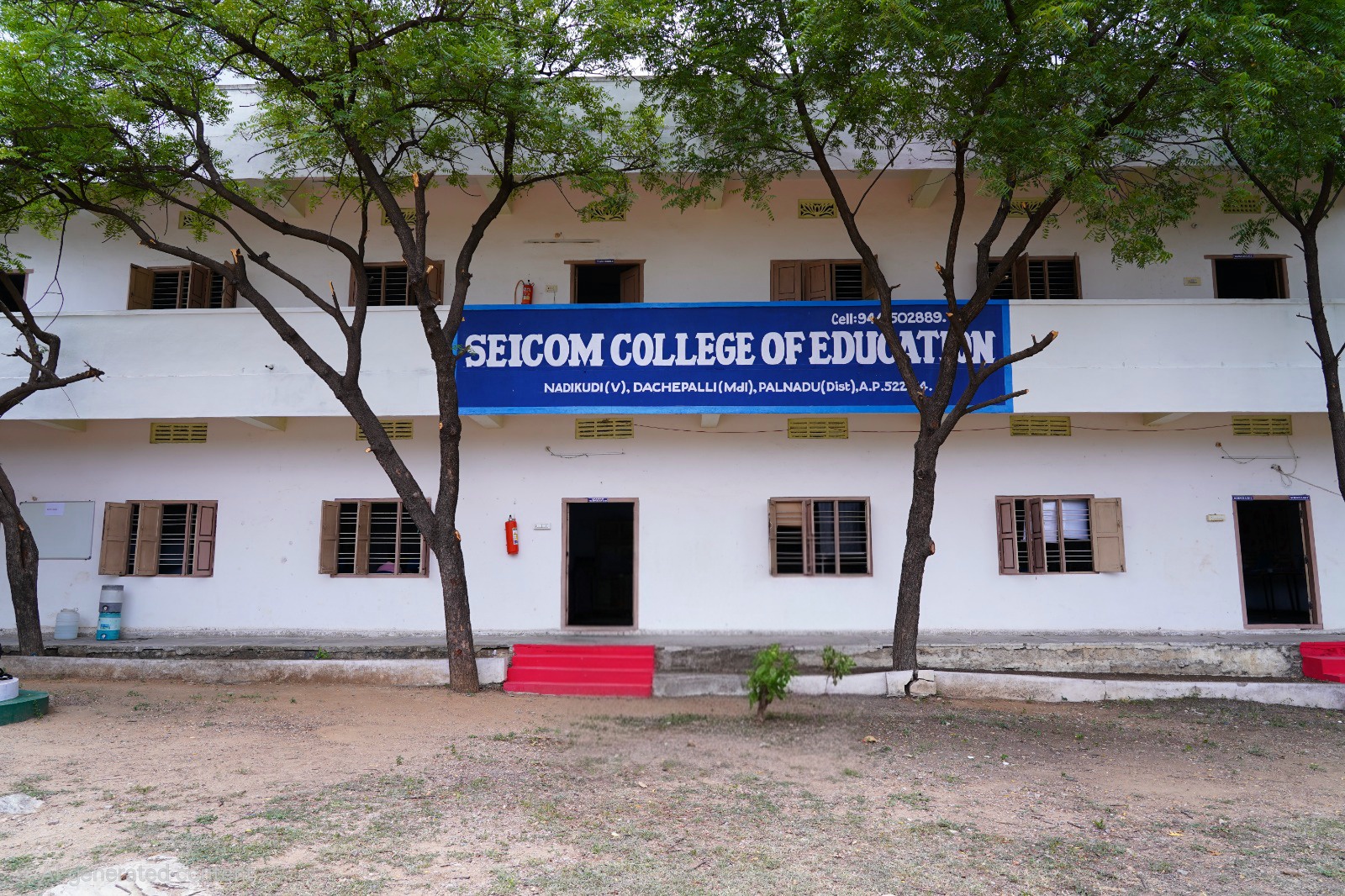 Front view of the SEICOM College of Education building beneath campus trees